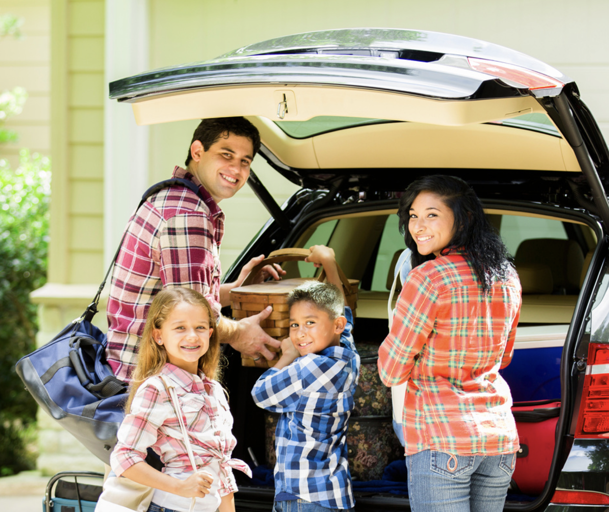 Family packing a car