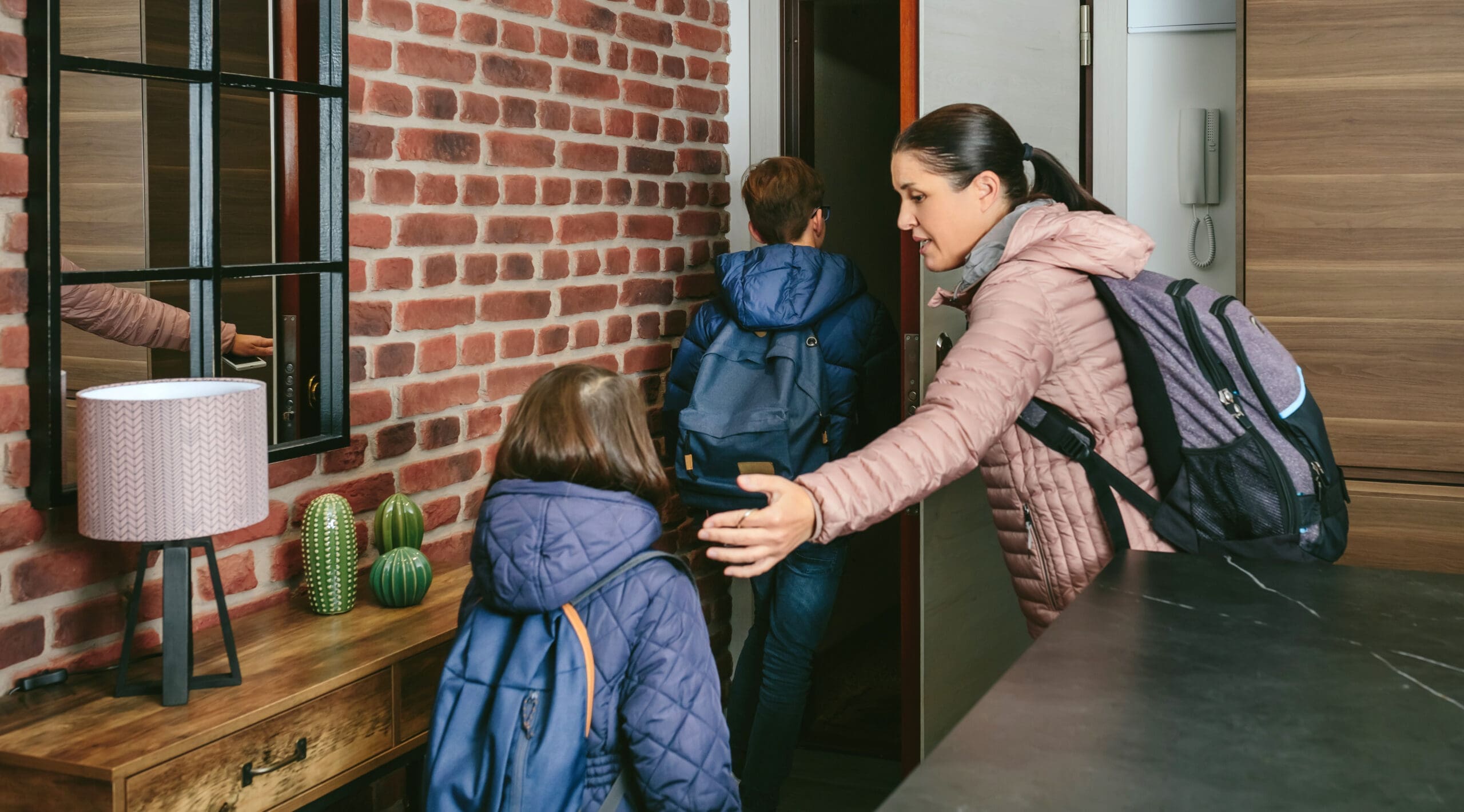 Family,With,Emergency,Backpacks,Leaving,Their,Front,Door,Quickly,Due
