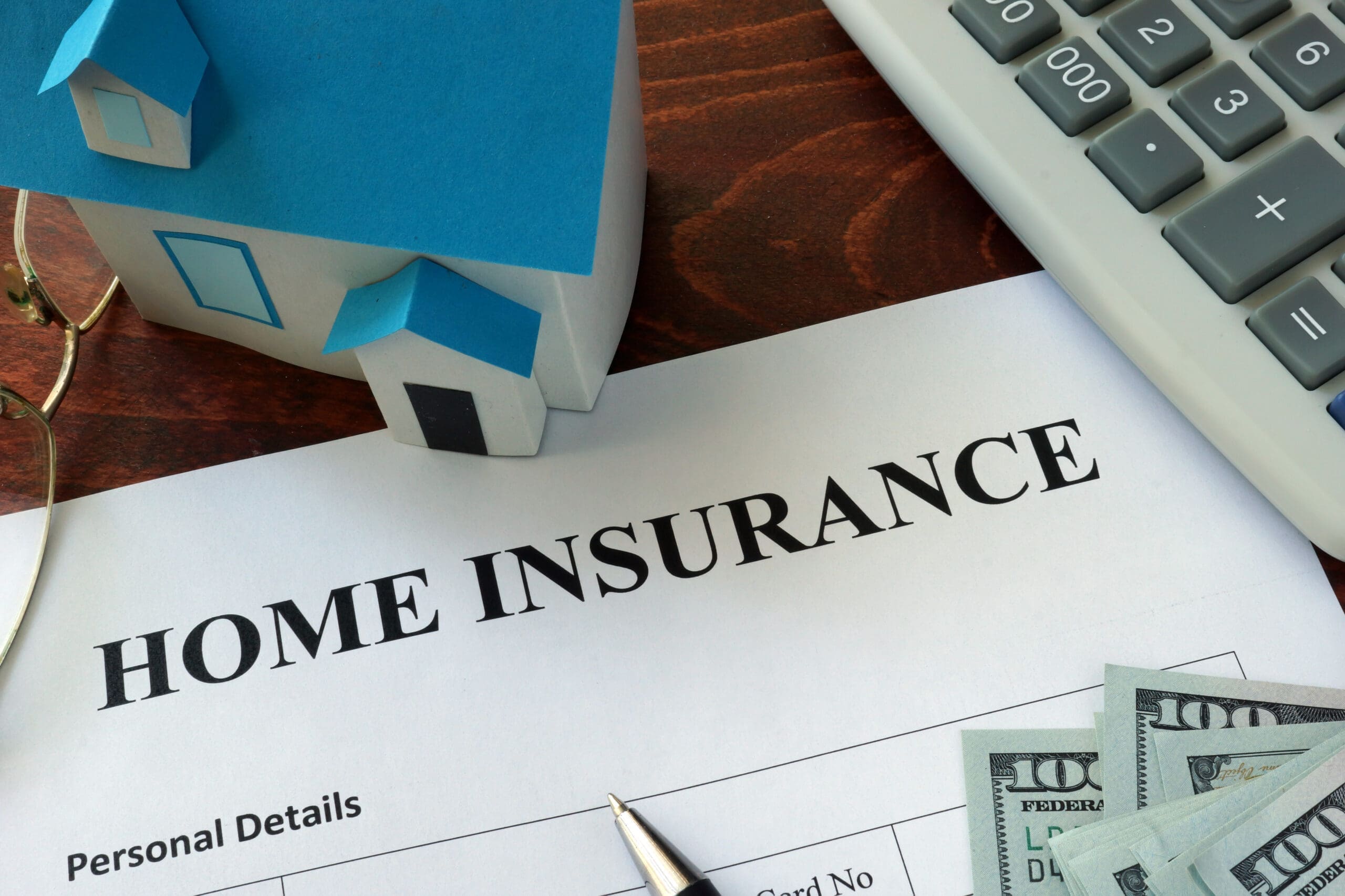 Home,Insurance,Form,And,Dollars,On,The,Table.
