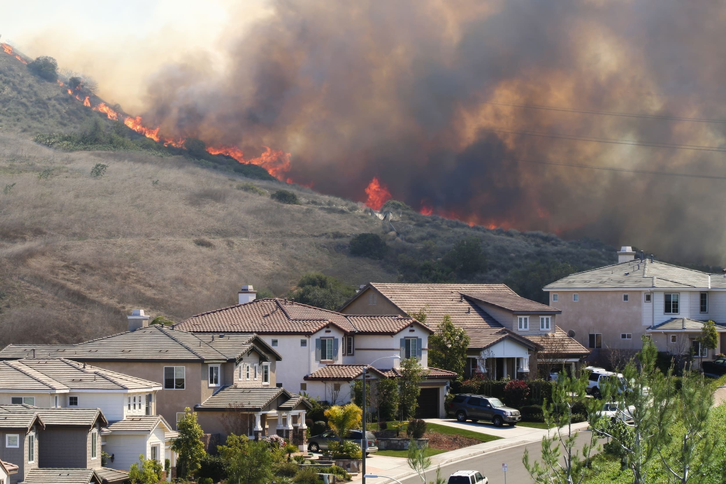 Southern California brush fire near houses